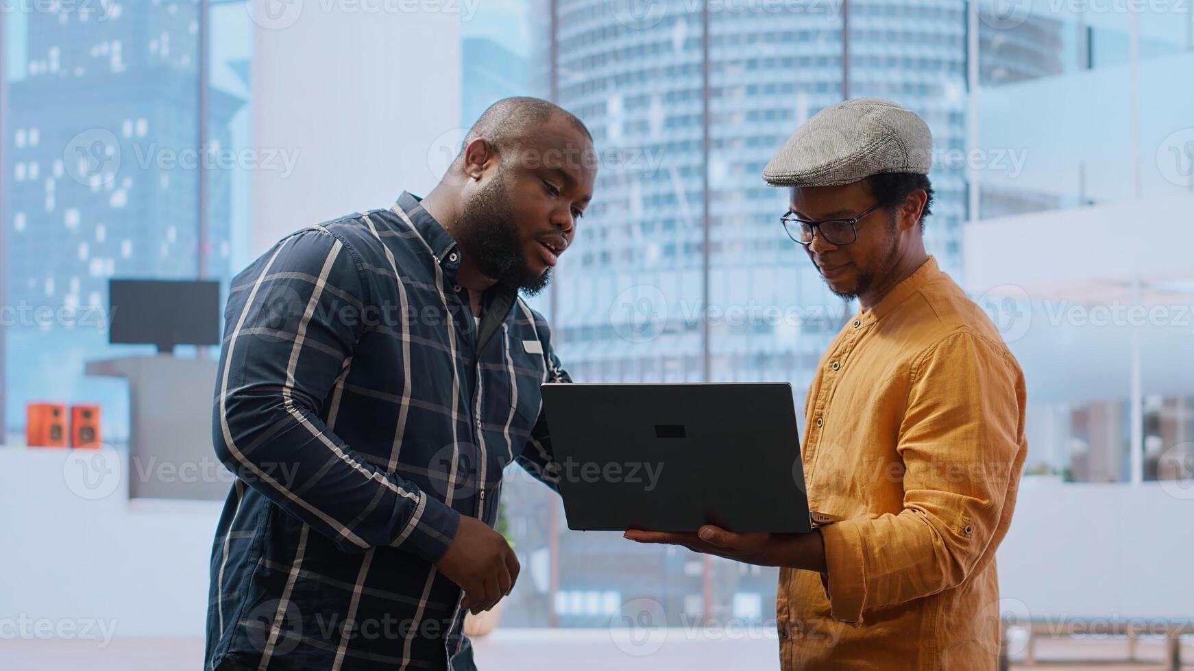 Entrepreneur talking about an investment in real estate office space, discussing with real estate agents team during an office tour. Detailed blueprints and layout of urban property. Camera B. photo