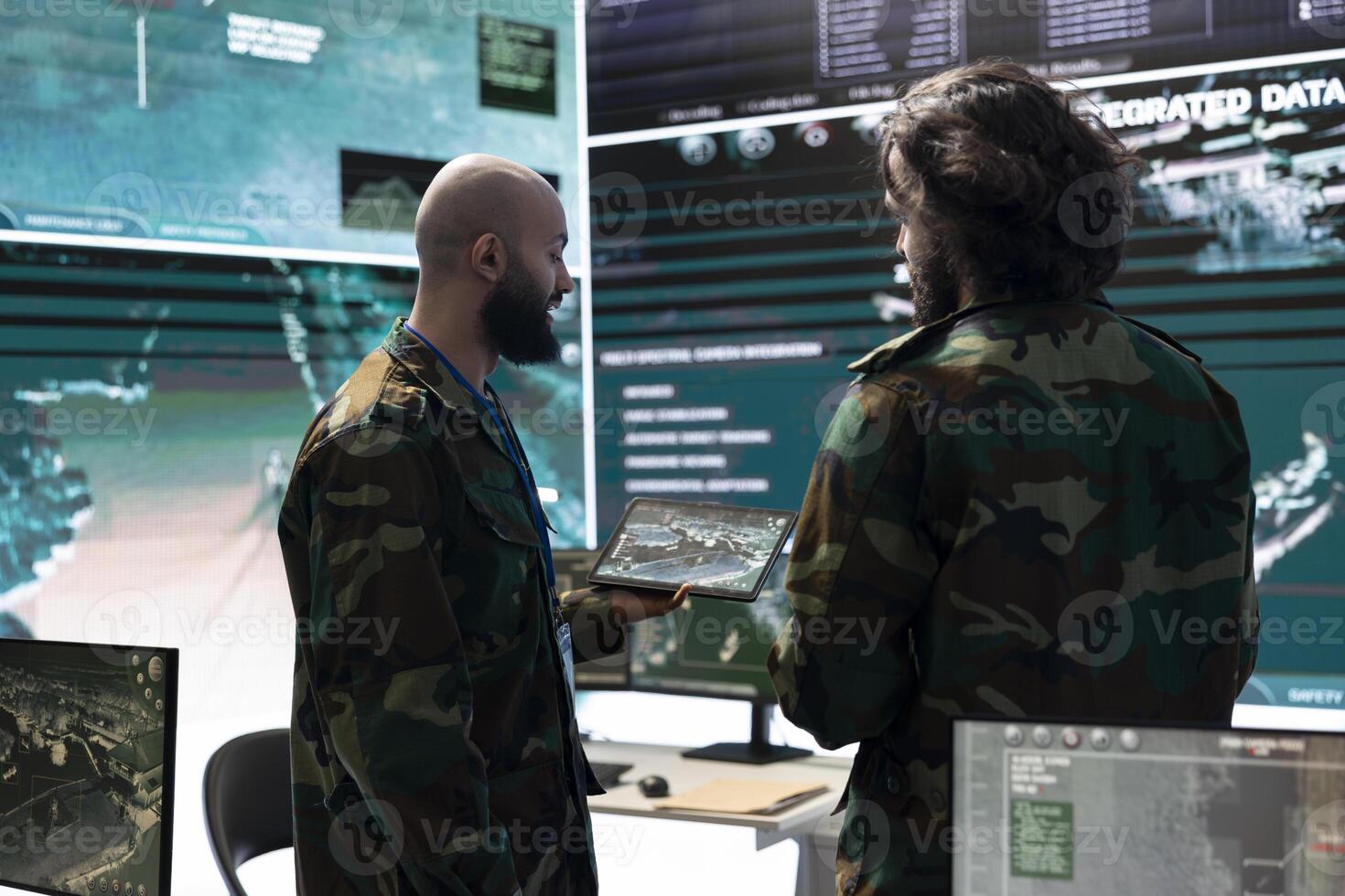 Military staff working on electronic intelligence gathering operation to intercept enemy communications or gps positions on world map. Personnel conducting reconnaissance missions. photo