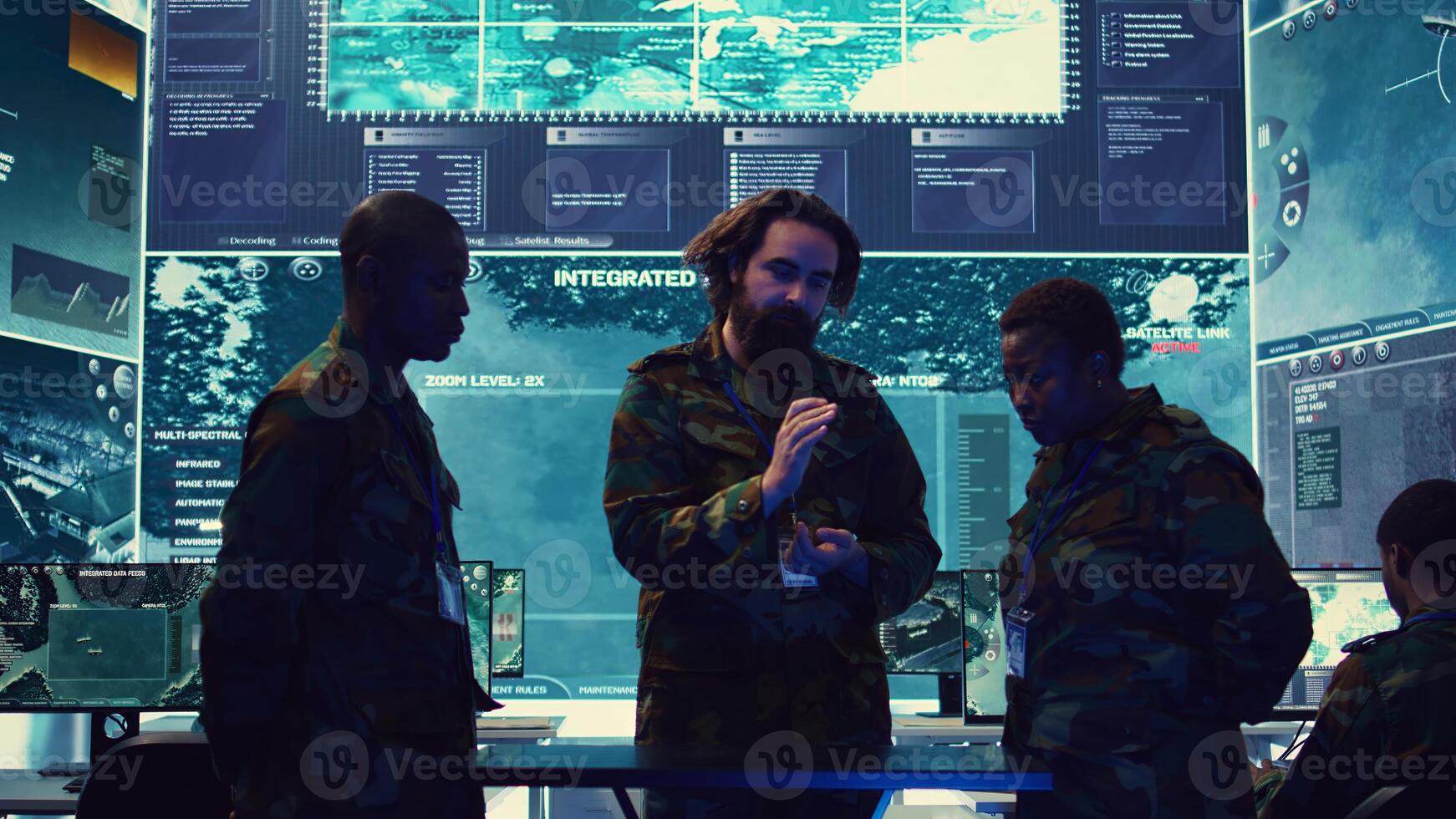 Army officers review data on a hologram to create a brief for the new mission, thinking of an operational plans after gathering important field information. High tech holographic image. Camera B. photo