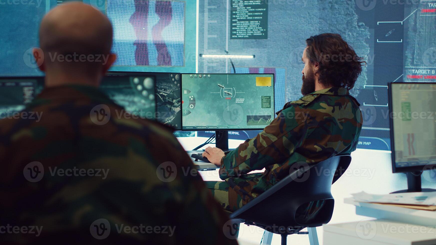 Diverse team of navy operators gather intelligence for future field missions, providing important information from CCTV satellite surveillance. Coordinating joint operations and strategies. Camera A. photo