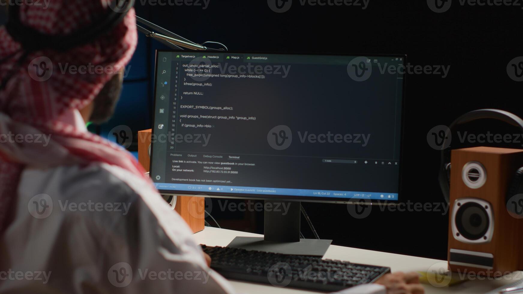 Certified arab engineer writing code on computer screen while in office using Java programming languages. Middle Eastern developer working on fixing database errors while working from apartment office photo