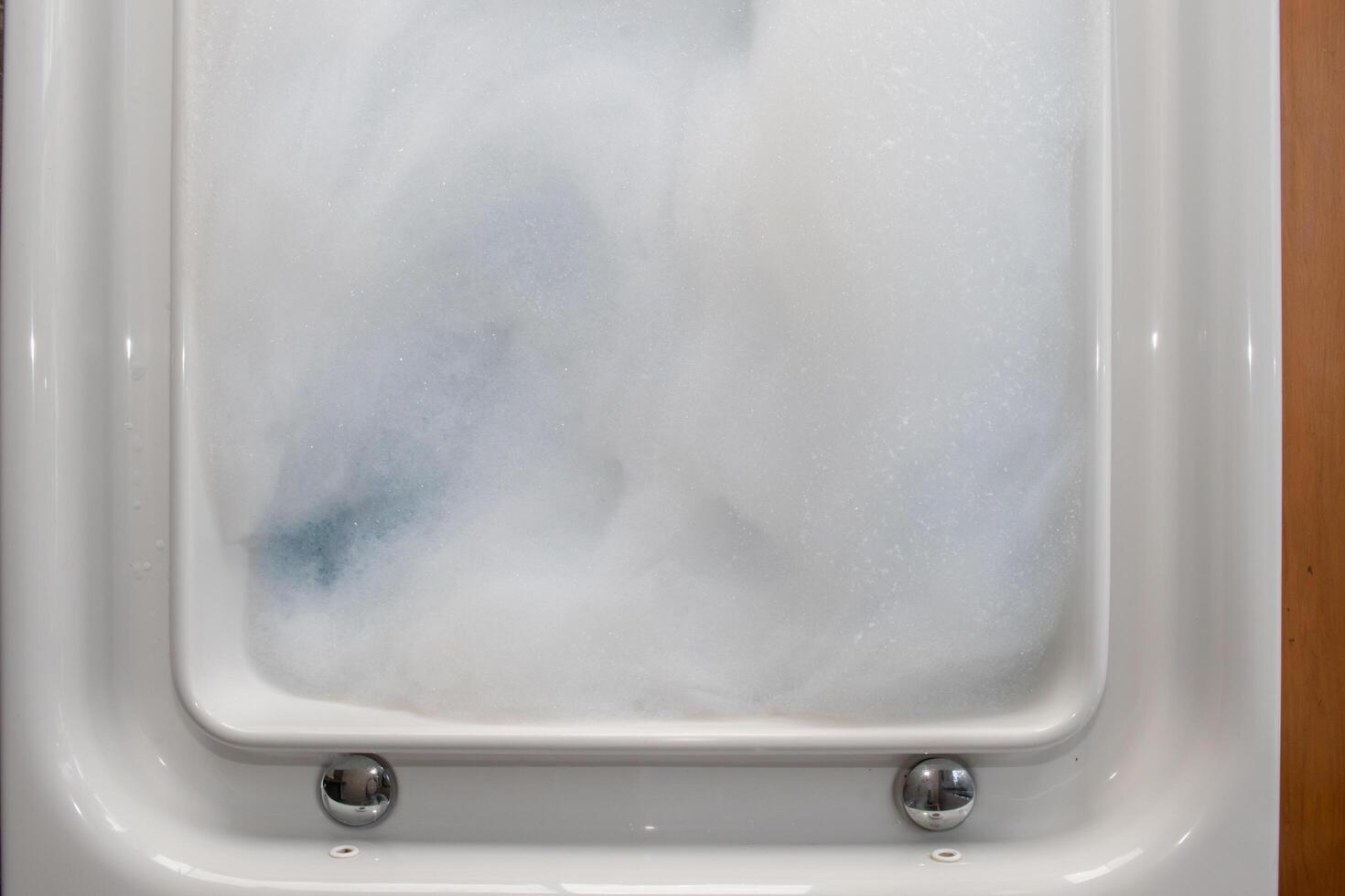 The white bubbles in the Jacuzzi tubs are the bubbles prepared for a private Jacuzzi bathing in the resort's comfortable guest rooms. Lots of small bubble backgrounds and Copy Space to insert text. photo