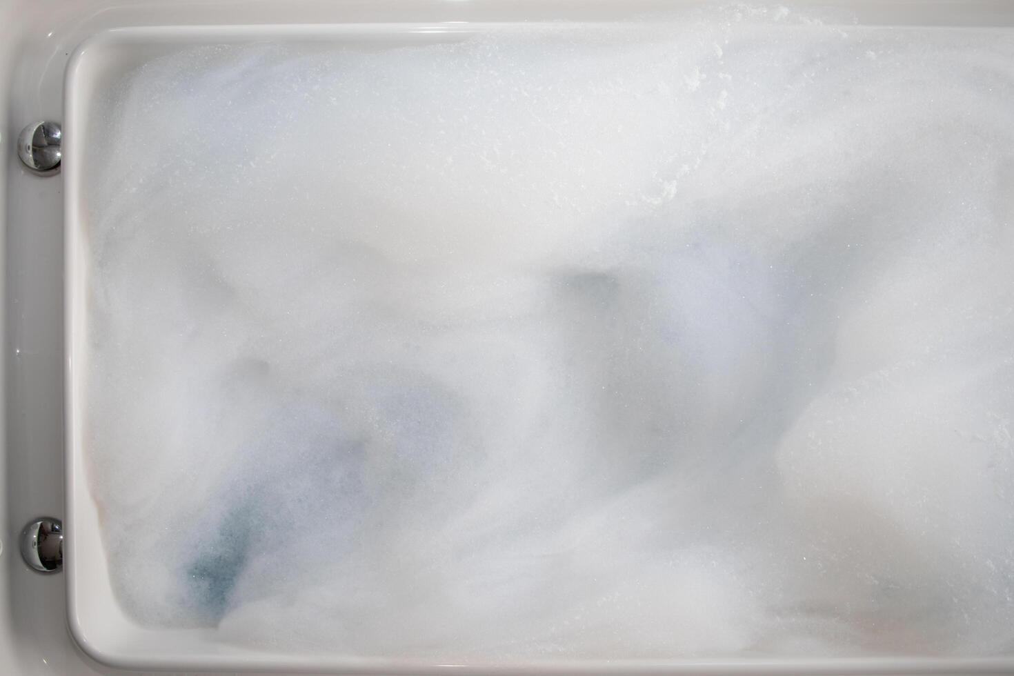 The white bubbles in the Jacuzzi tubs are the bubbles prepared for a private Jacuzzi bathing in the resort's comfortable guest rooms. Lots of small bubble backgrounds and Copy Space to insert text. photo