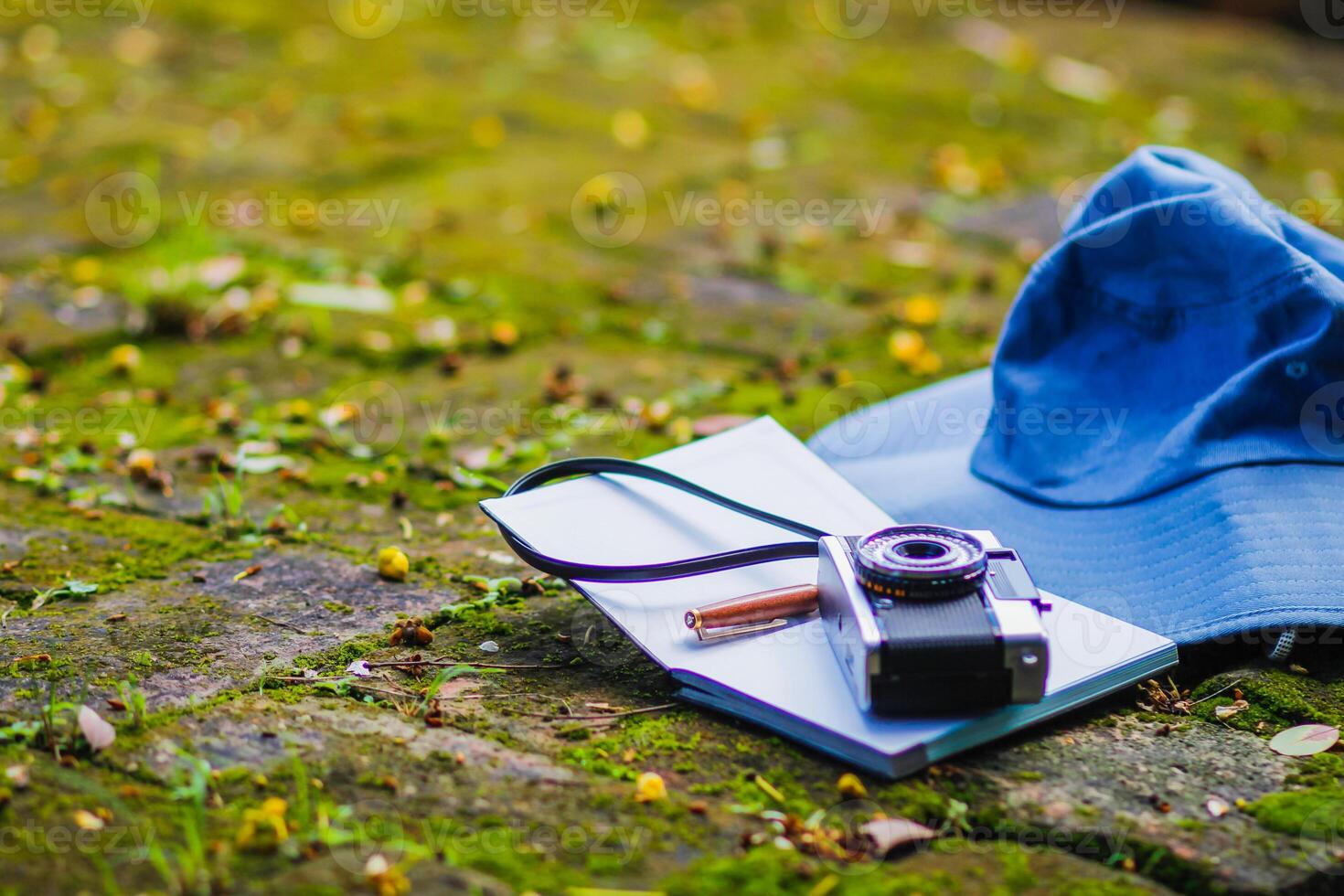A young photographer is traveling and capturing impressive images of the temple with a film camera. Young photographer chooses to travel and record impressive images in Chiang Mai, Thailand photo