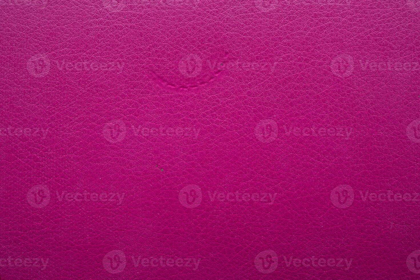 pink faux leather background is used to wrap book covers or to repair everyday leather sofa seats and appliances. background and pattern on the pink faux leather have space for text. photo