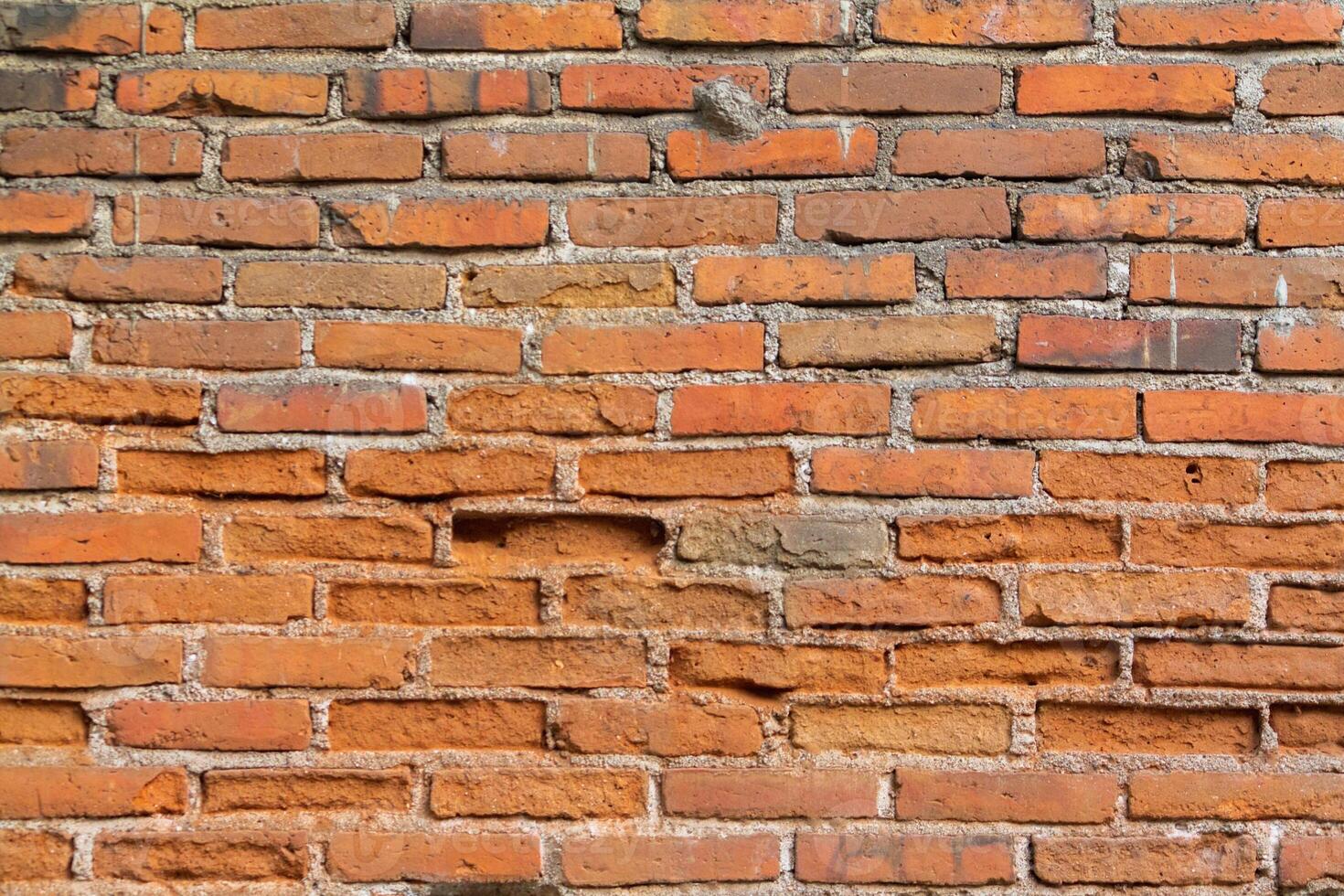 Brick wall background is a wall made of clay bricks, giving the structure strength and cement line between bricks that looks beautiful. It is popular to build a wall of ancient monuments.copy space, photo