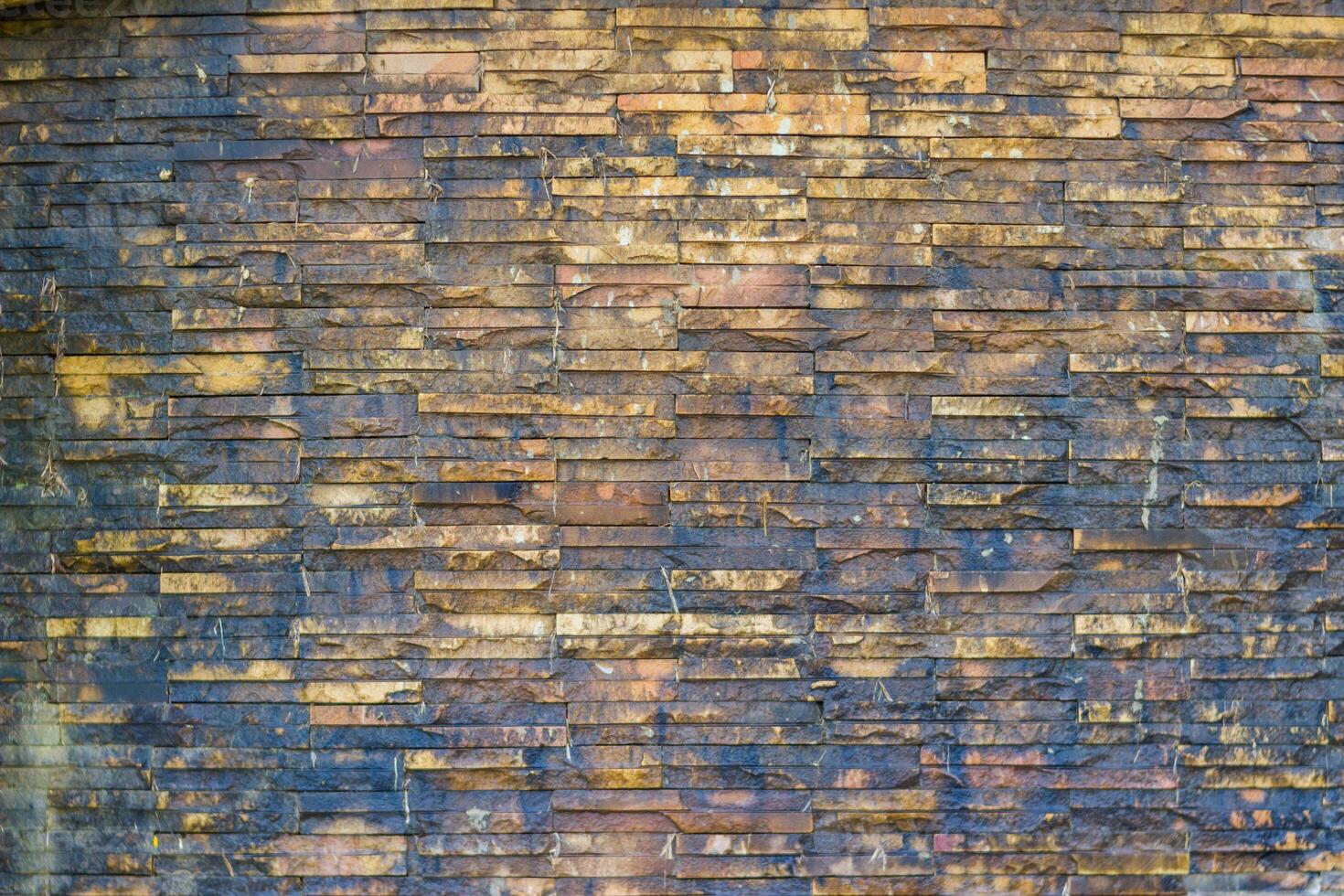 Brick wall background is a wall made of clay bricks, giving the structure strength and cement line between bricks that looks beautiful. It is popular to build a wall of ancient monuments.copy space, photo