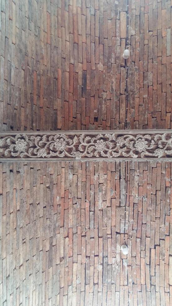 Brick wall background is a wall made of clay bricks, giving the structure strength and cement line between bricks that looks beautiful. It is popular to build a wall of ancient monuments.copy space, photo