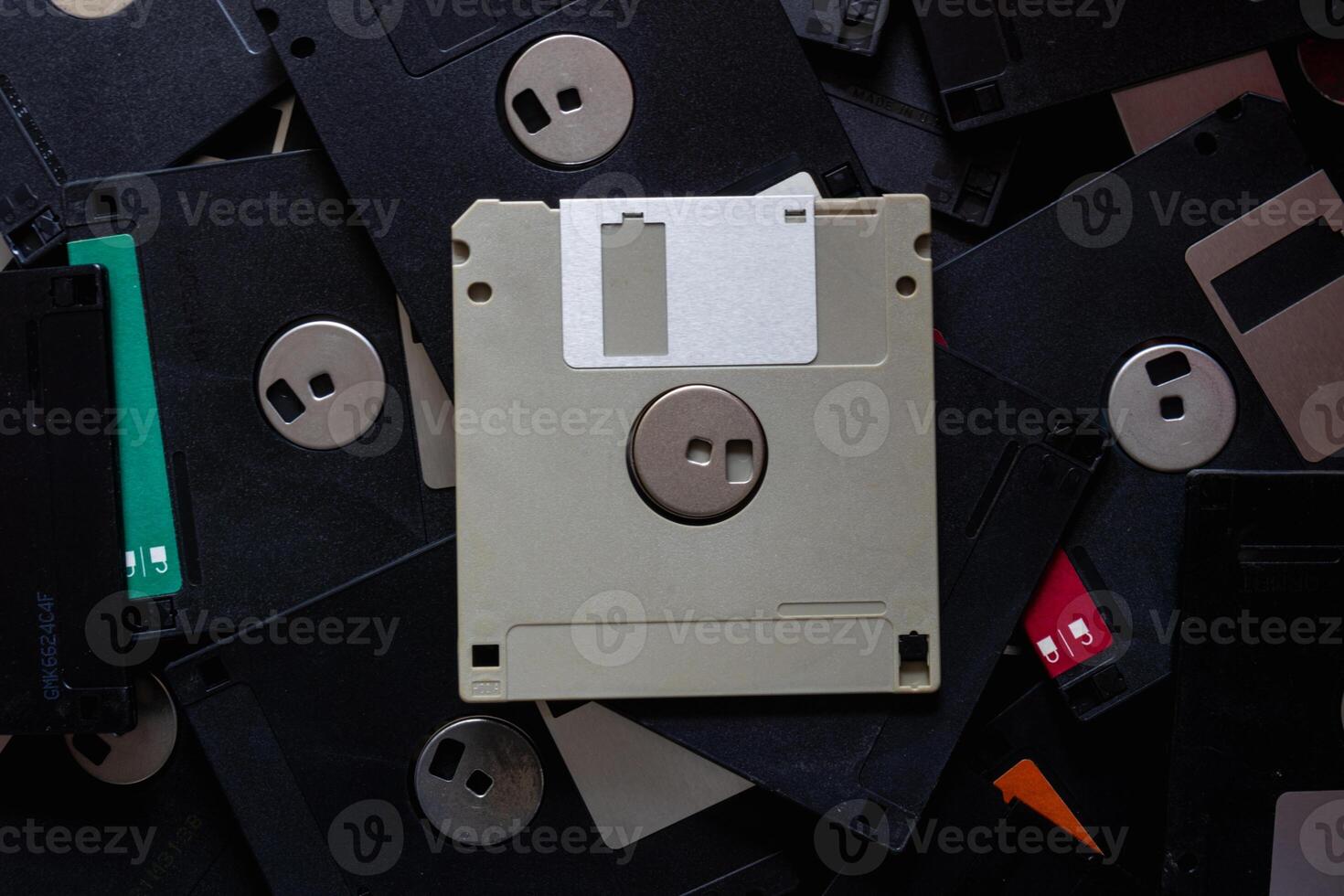 A square floppy disk is a magnetic disk for storing data in an old computer with a small capacity, but floppy disks were still popular in those days because there was no alternative. photo