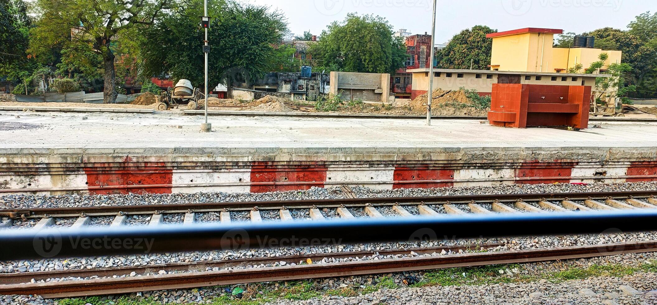 Empty train station landscape on a village from the train window photo