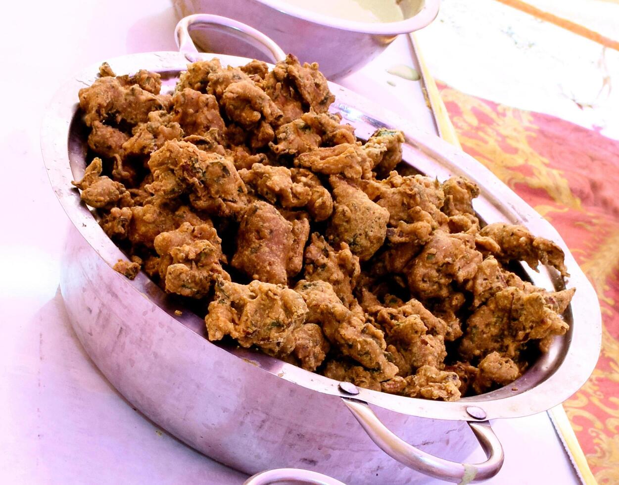 Crispy onion bhajis or kanda or pyaj ke pakore or pakoda photo