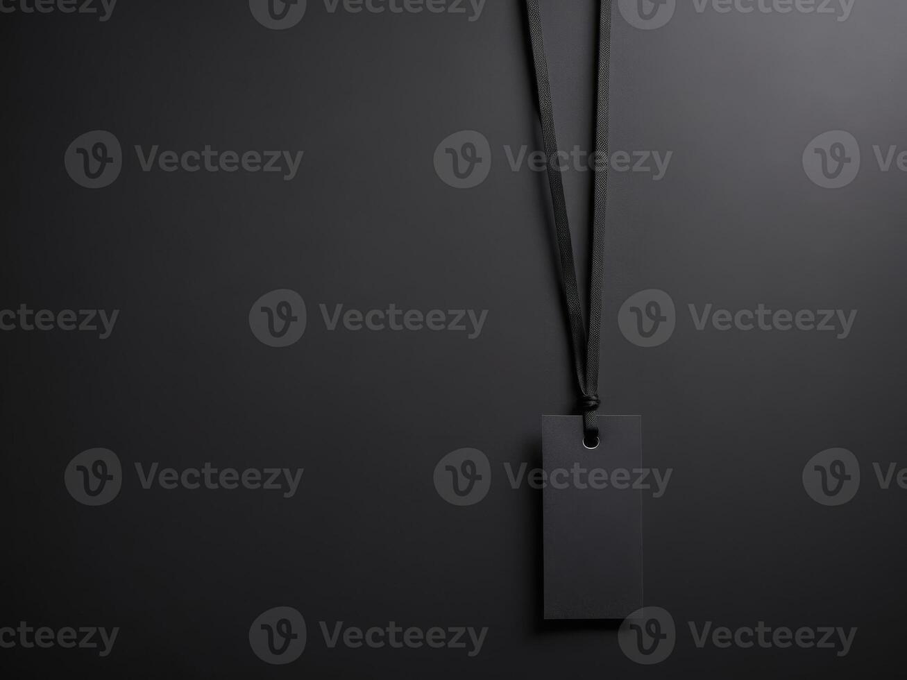Black Paper Price Label With String Isolated on black background. photo