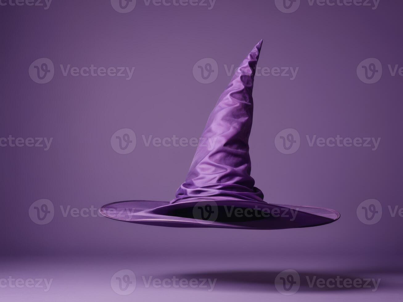 purple witch hat isolated on purple background. photo