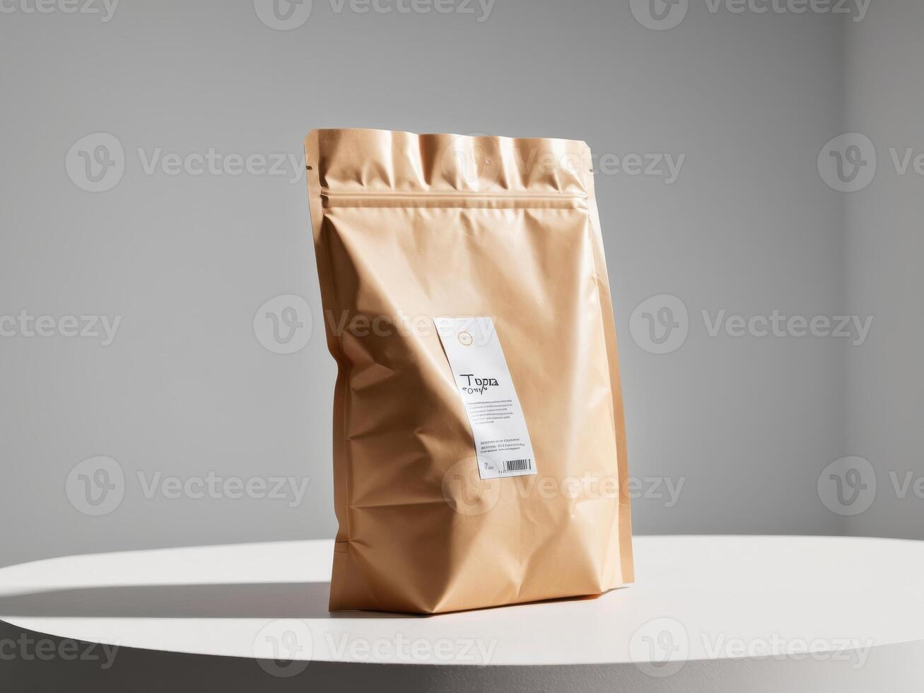 brown cream paper doypack placed on a podium on an empty background. photo
