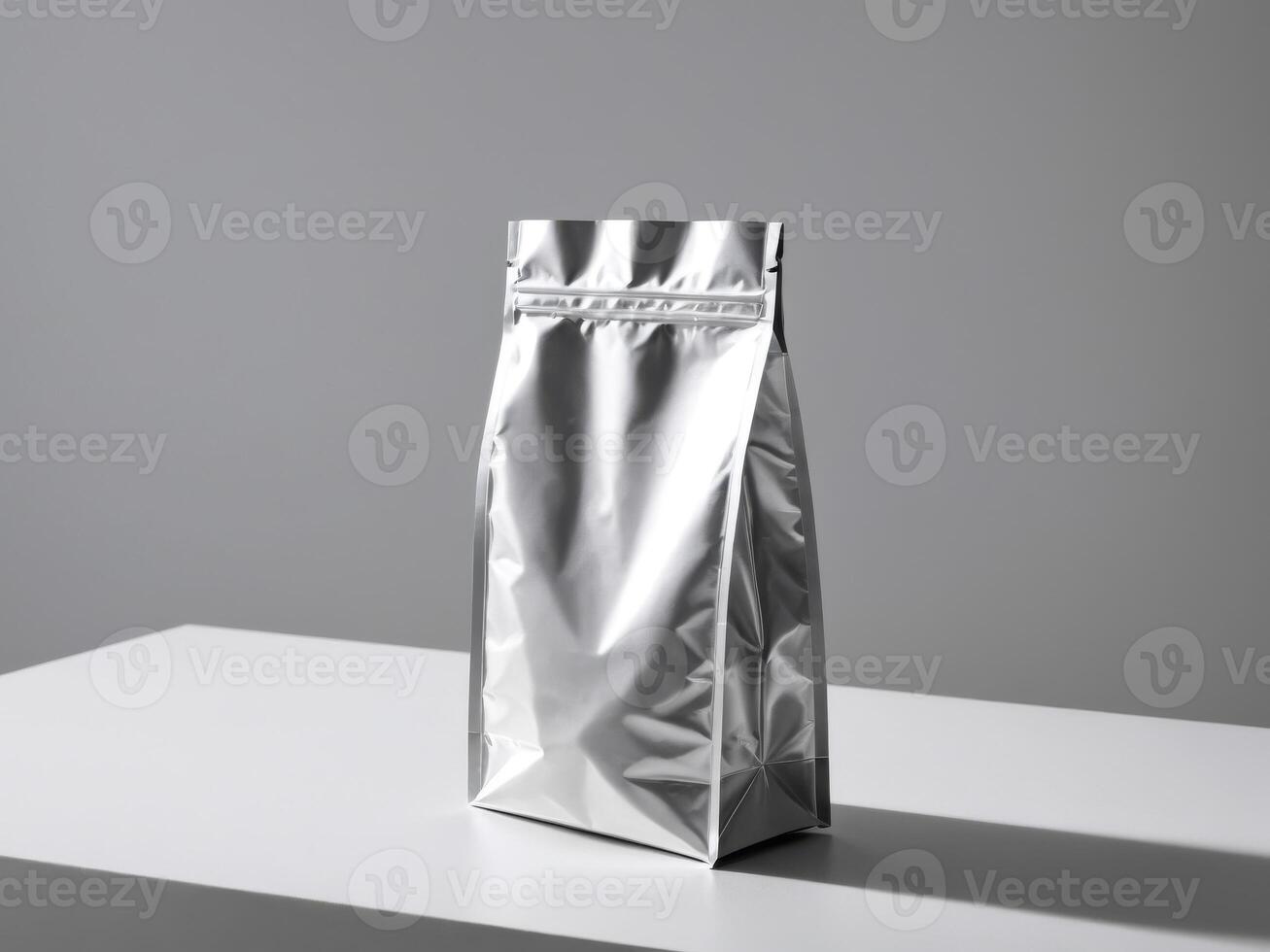 silver paper doypack placed on a podium on a blank background. photo