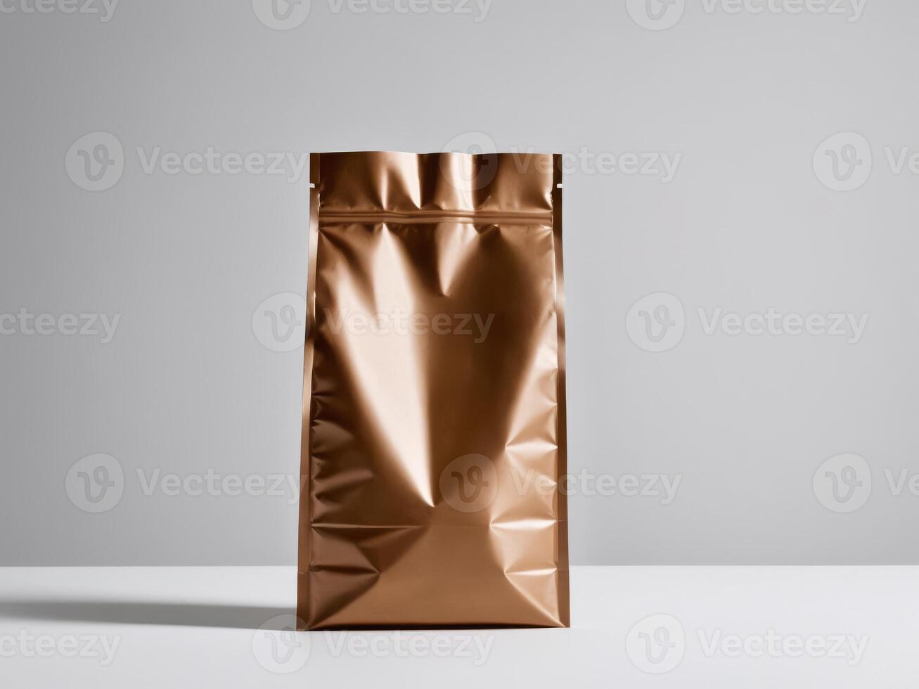 A bronze paper doypack is placed on a podium with an empty background. photo
