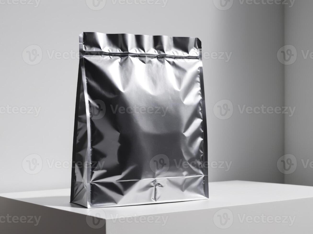 silver paper doypack placed on a podium on a blank background. photo