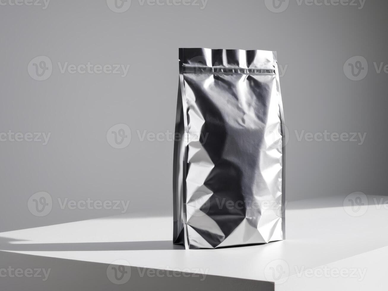 silver paper doypack placed on a podium on a blank background. photo