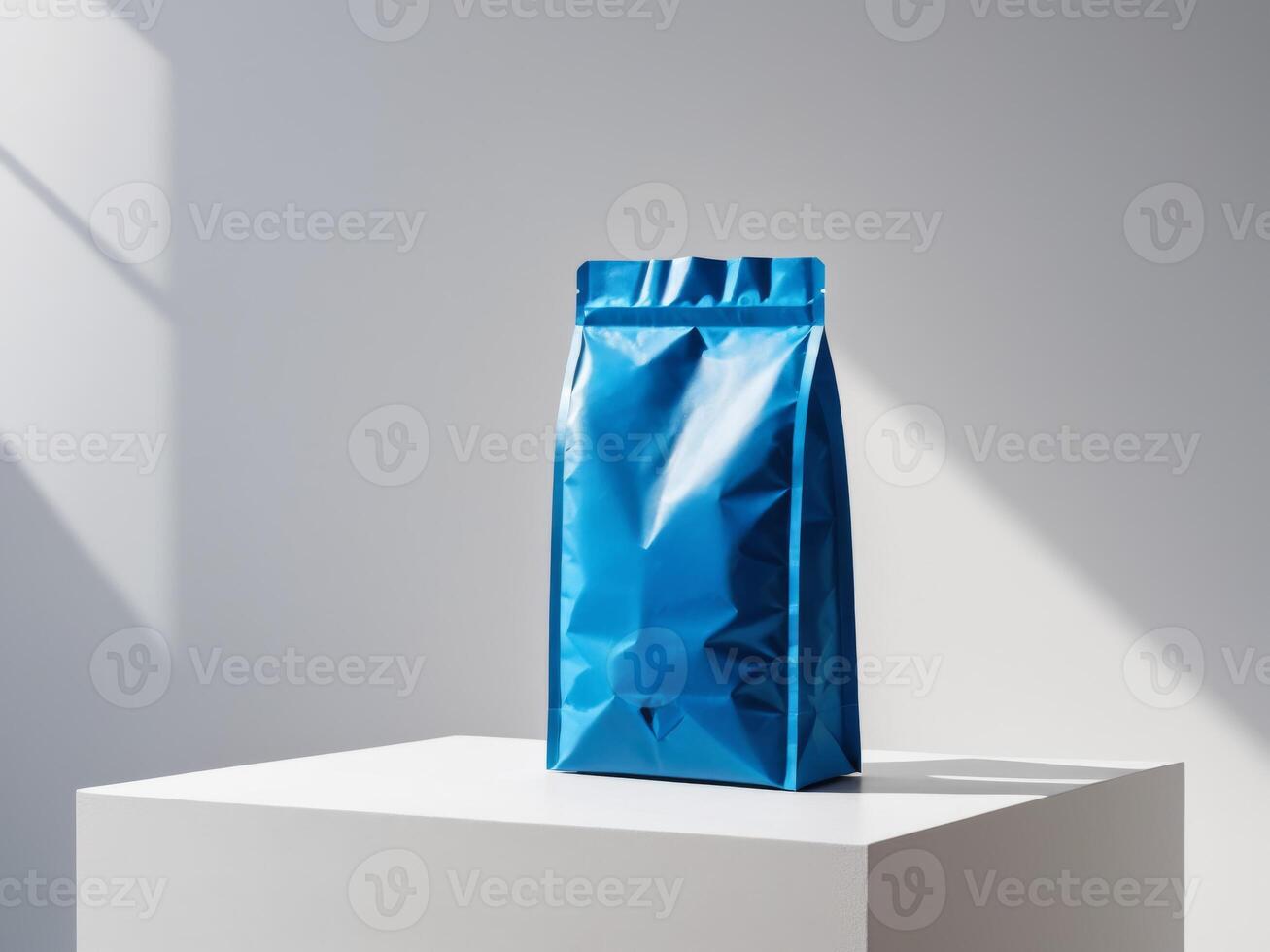Blue paper doypack placed on podium on empty background. photo