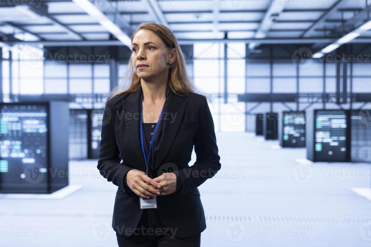 System administrator in data center identifying and solving technical issues related to data center infrastructure. IT expert managing, maintaining and securing high tech server hub environment photo