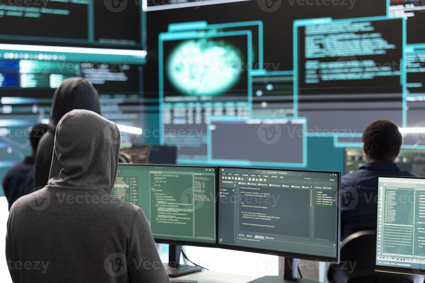Governmental hacker examines info on a big screen in agency office, using advanced technology to secure computer networks. Working on cyber security and defending against cyberwarfare. photo