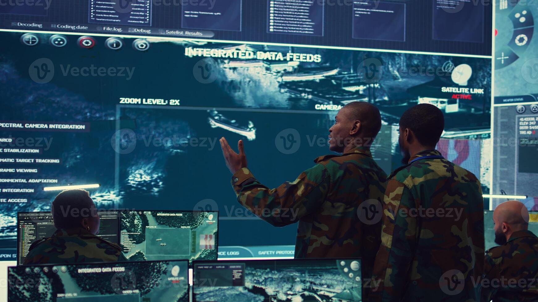 High ranking military personnel briefs the crew for a new federal mission, showing CCTV footage of satellite radar target ships for reconnaissance. Army officers provide intelligence. Camera B. photo