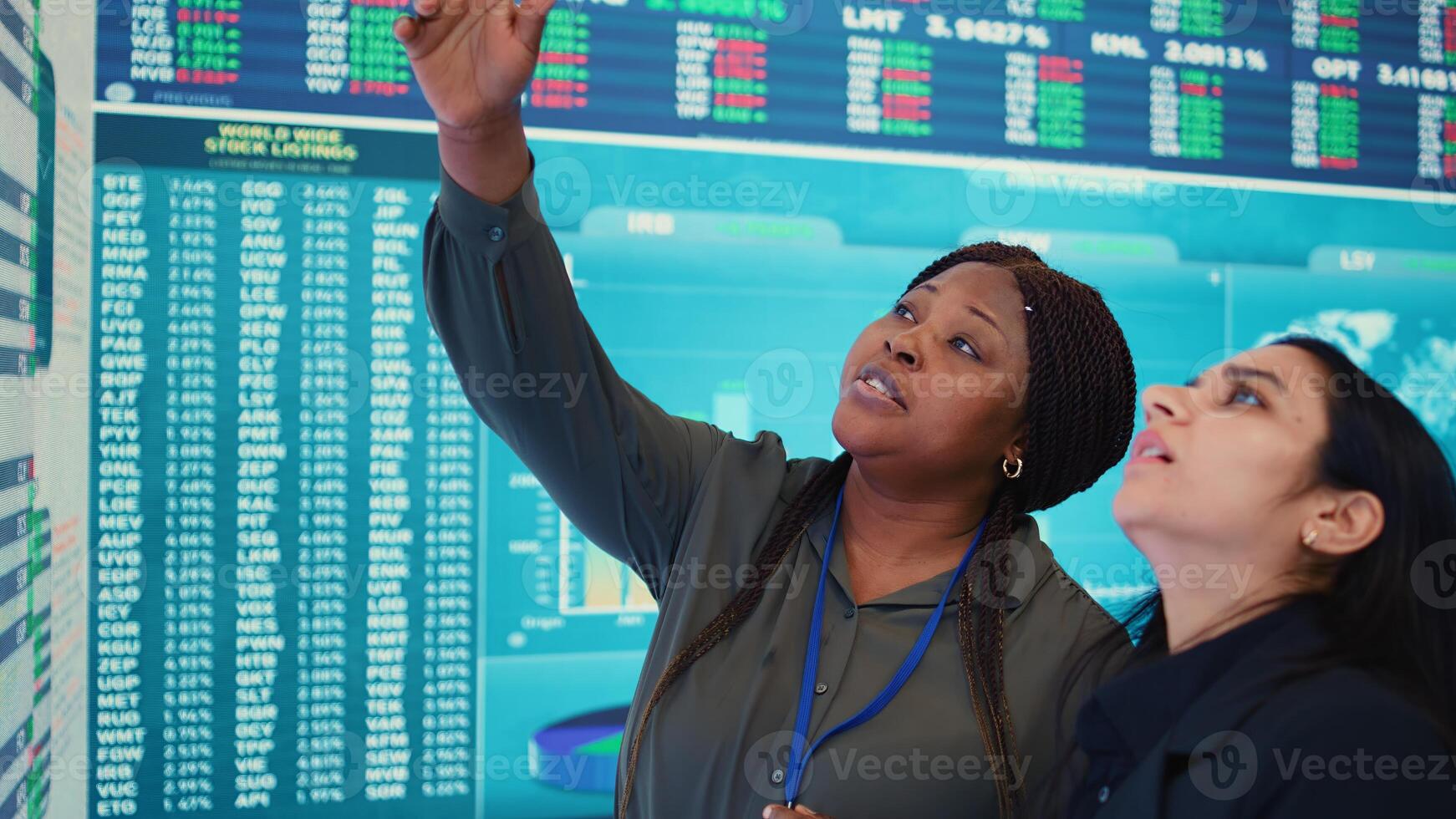 Enterprise colleagues reviewing efficiency and performance metrics within the organization, giving project insight. Partners evaluating statistics and data reports on a big screen. Camera B. photo