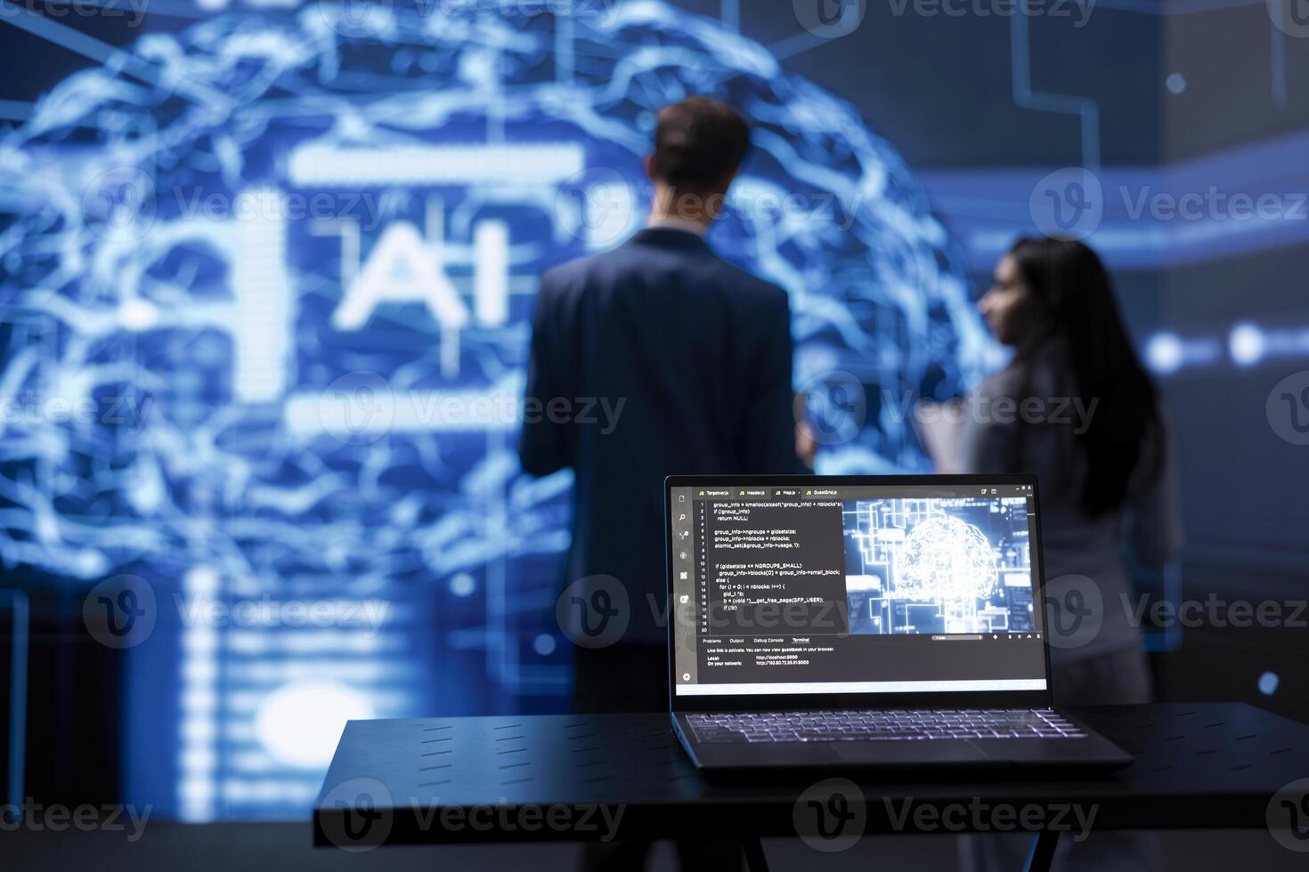 Focus on laptop running AI cognitive computing tech used by IT staff members in blurry background. Close up of notebook used by teamworking engineers to do data mining with self learning algorithms photo