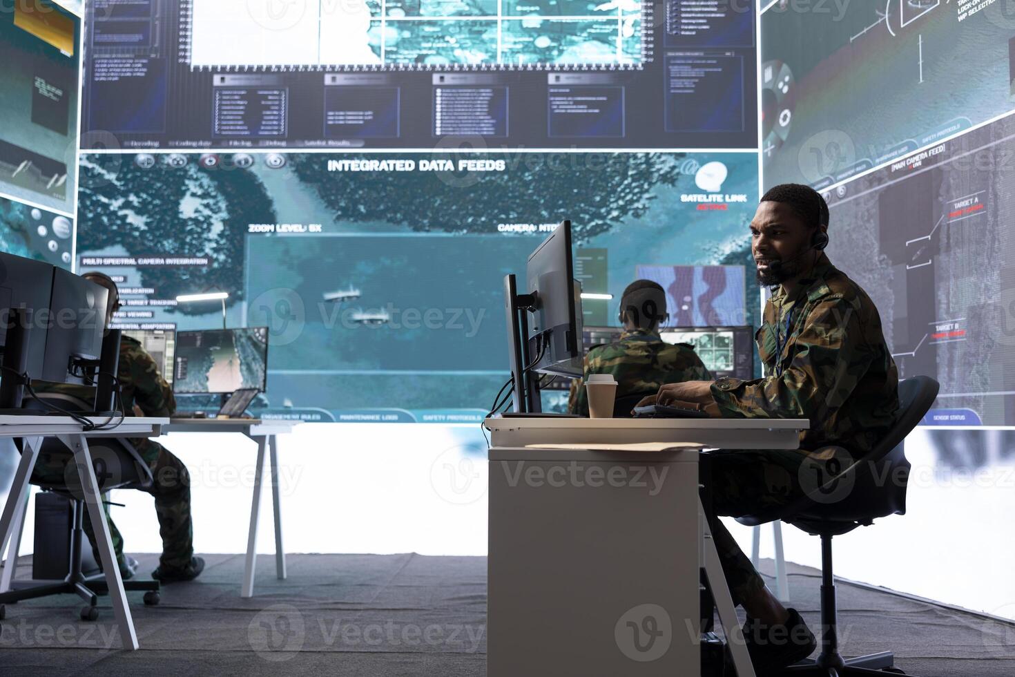 Army intelligence expert utilize advanced computer systems and satellite data to protect national security, support and maintain operational efficiency in a high tech command center military base. photo