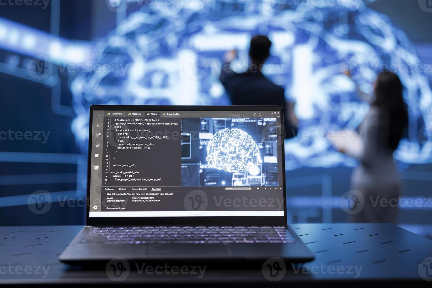 Focus on laptop running AI cognitive computing tech used by coworkers in blurry background. Close up of notebook used by programmers team to do data mining with self learning algorithms photo