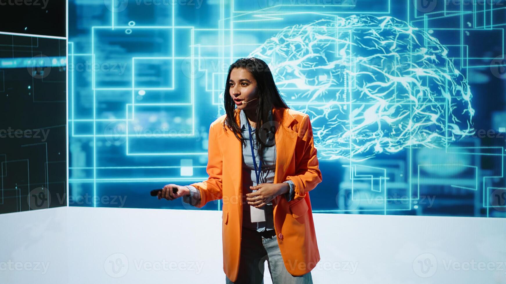 Upbeat presenters speak at AI forum gathering tech startups managers, investors and academics. IT specialists moderating discussion panels helping companies tap into artificial intelligence, camera A photo