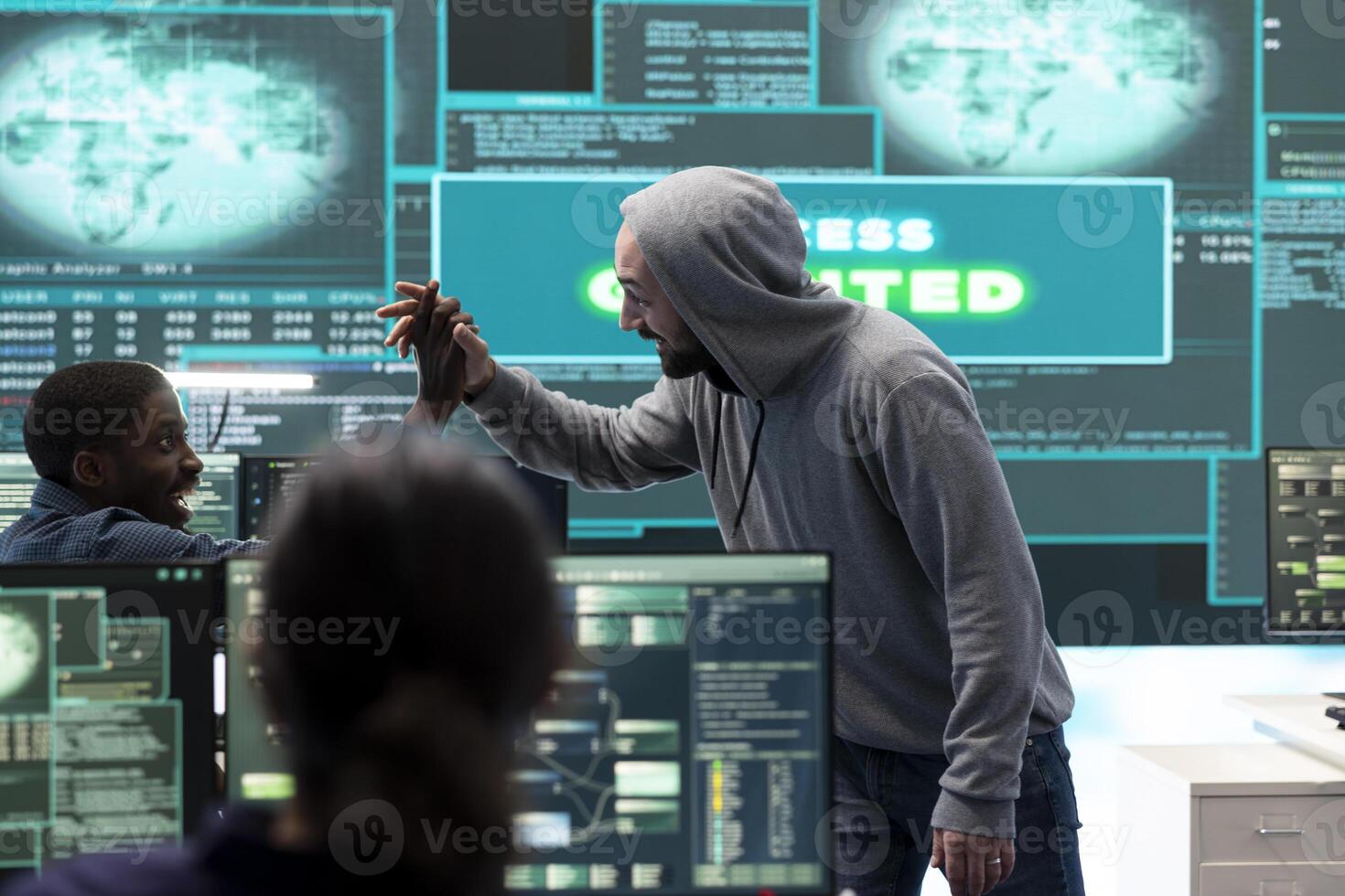 Group of professional hackers gaining access into government database to steal important information for hybrid warfare. Experts work on scams and phishing activity in high tech office. photo
