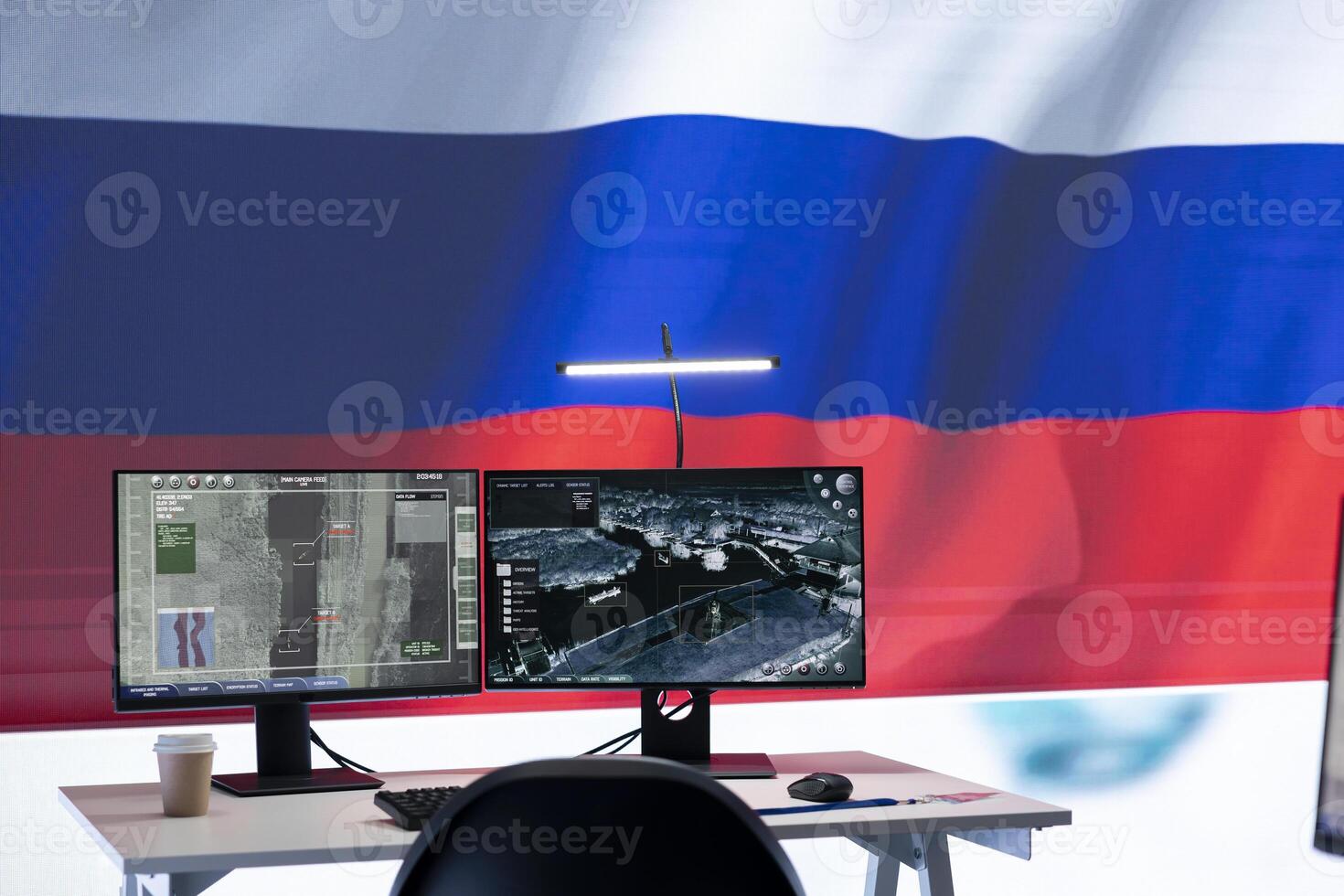 Empty army command center monitoring room agency with the russian flag on big screen, spreading propaganda messages and fake news to scare the people. Military Russian federation power. photo