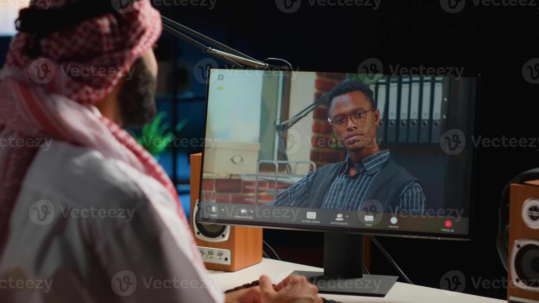 Arabic worker in call session with therapist, asking for advice, feeling down. Remotely working Middle Eastern employee in online consultation with psychologist from stylish cozy home photo