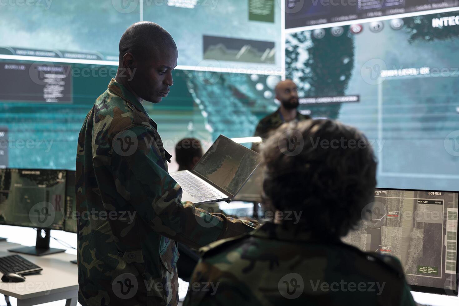 Intelligence analyst collecting satellite surveillance real time data and transmitting battlefield information to infantry unit. Trooper engineer working on military defense program, army division. photo