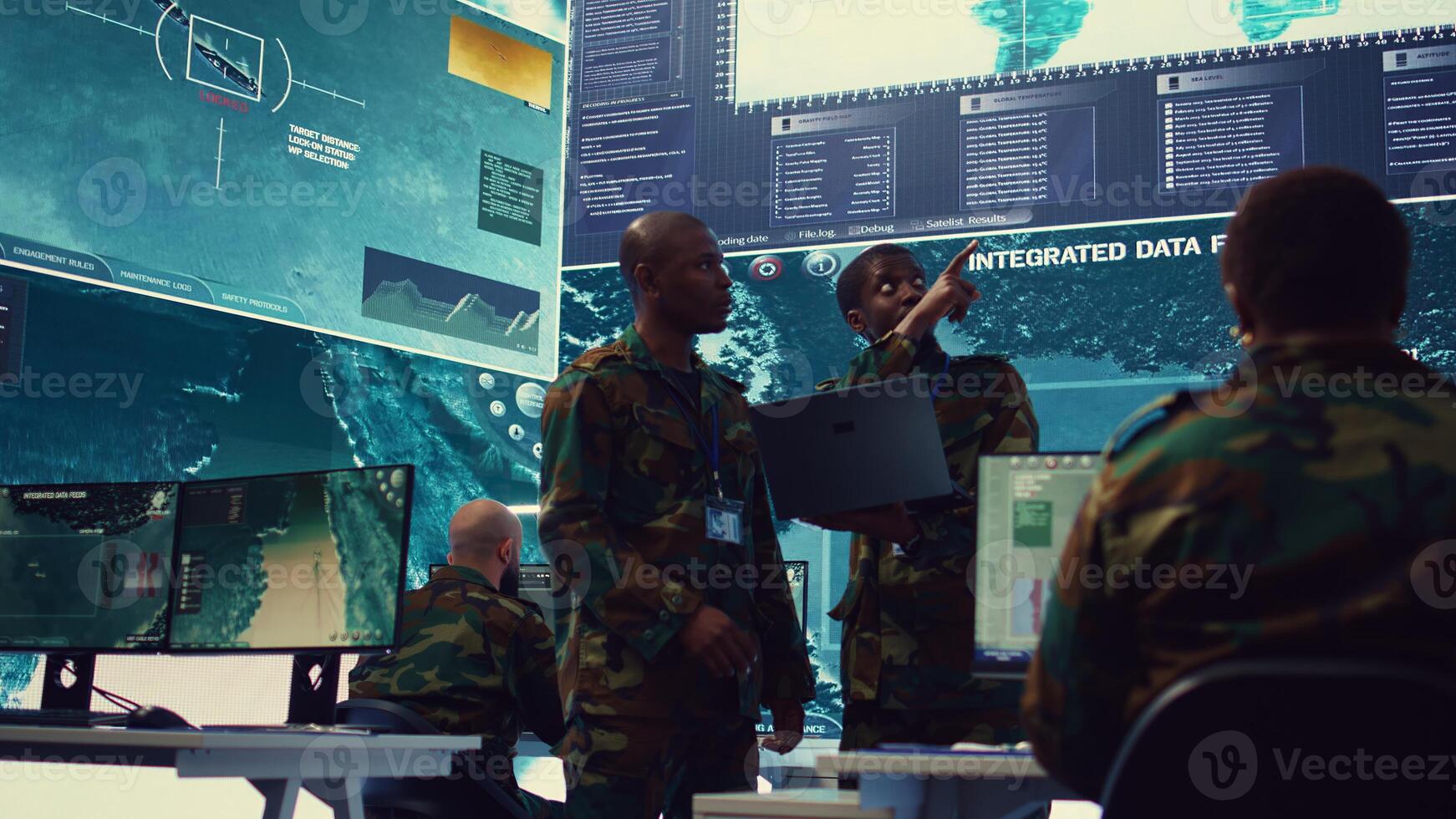 Signal support systems specialists work with battlefield data and terminal devices in military command post. Reconnaissance operators targeting enemy warships on CCTV radar. Camera B. photo