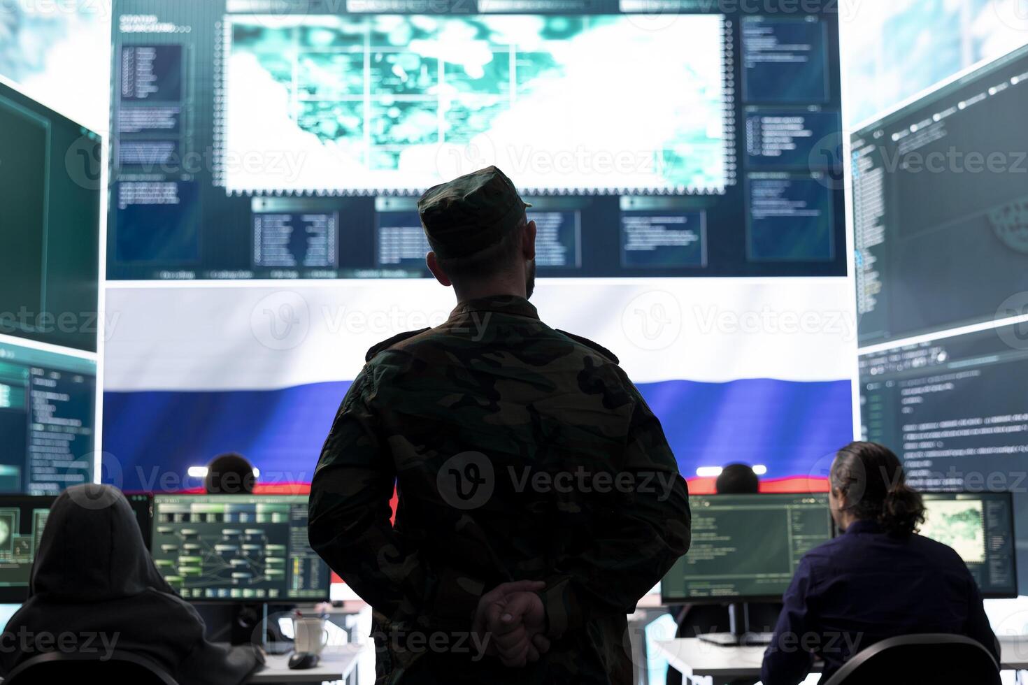 Military expert hacker from Russian army working in governmental operations center, breaking into rival states network to spread fake news and hybrid war propaganda. Brainwashing strategy. photo