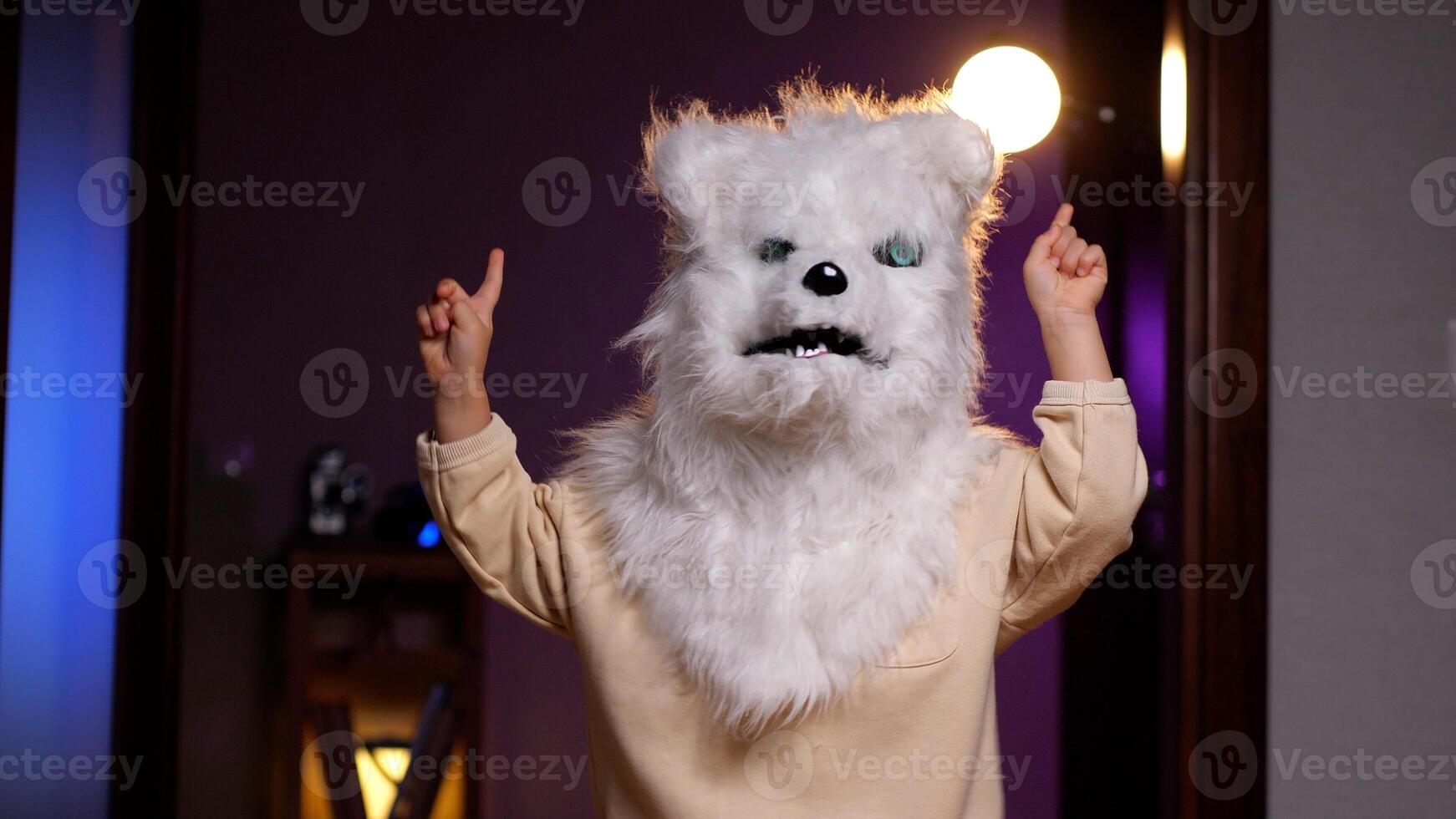 portrait of a little girl in a white wolf or dog mask photo