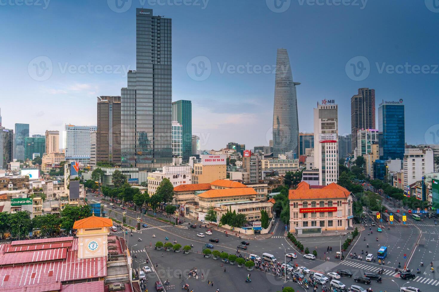 Night view of busy traffic in crowded intersection near Ben Thanh market in Ho Chi Minh city. Ben Thanh market is the symbol of Saigon, Vietnam photo