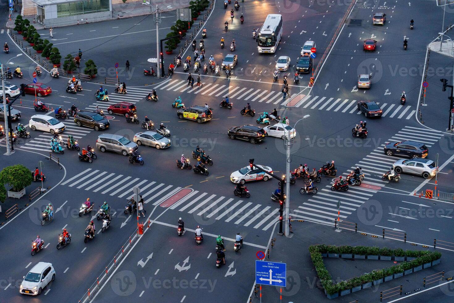 Night view of busy traffic in crowded intersection near Ben Thanh market in Ho Chi Minh city. Ben Thanh market is the symbol of Saigon, Vietnam photo