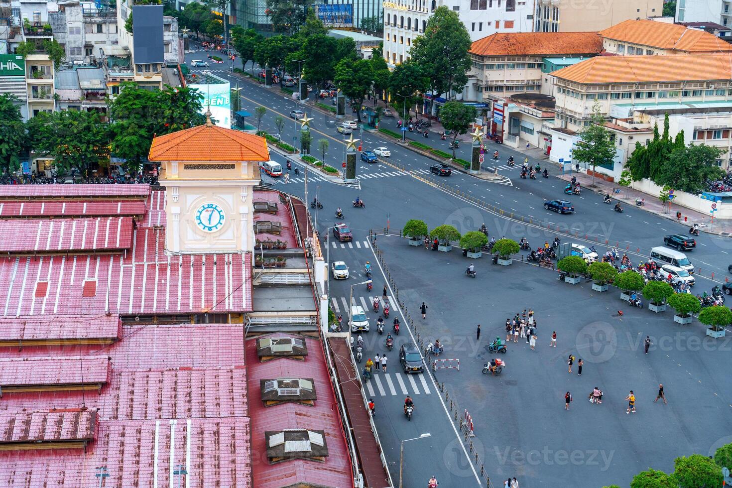 Night view of busy traffic in crowded intersection near Ben Thanh market in Ho Chi Minh city. Ben Thanh market is the symbol of Saigon, Vietnam photo