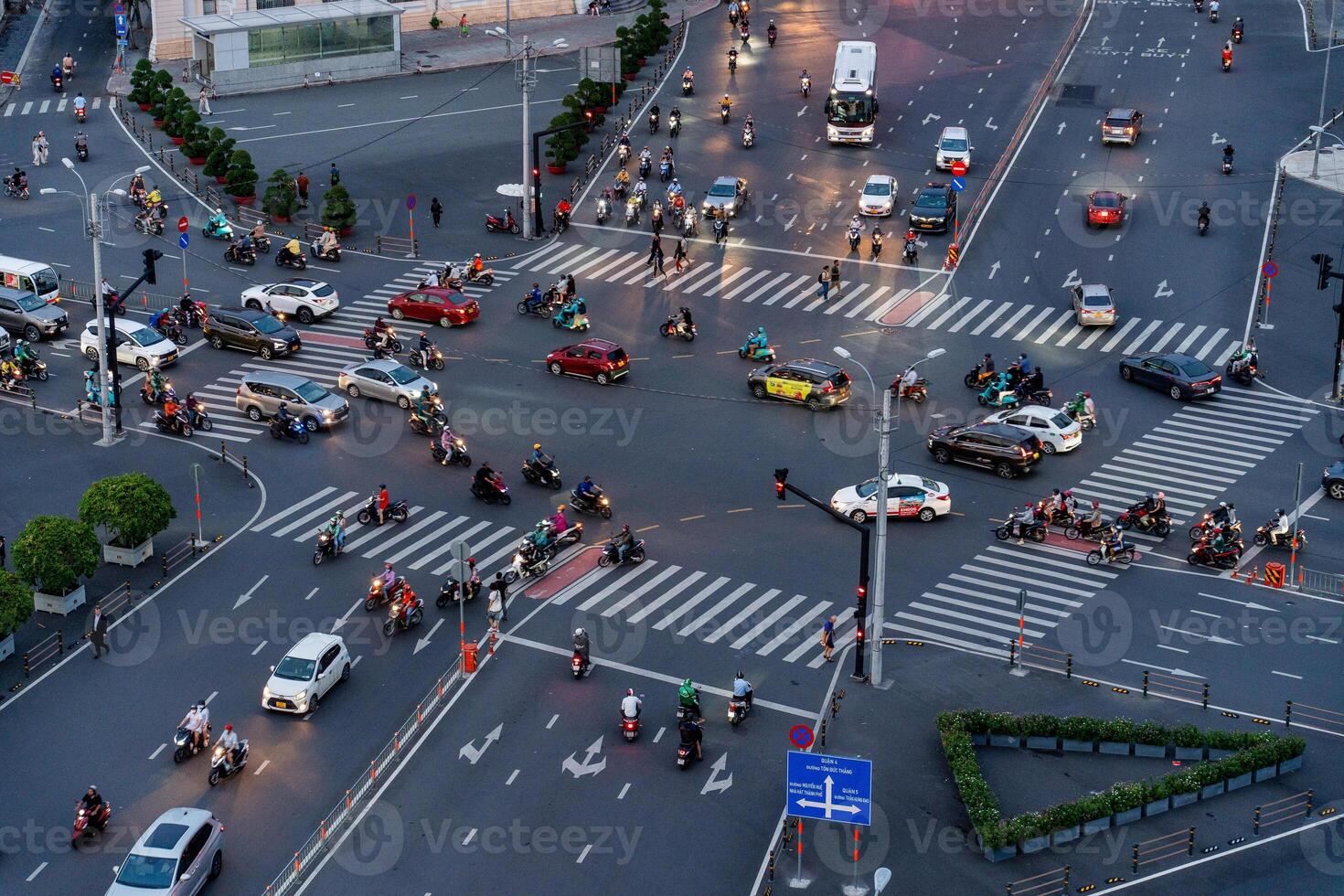 Night view of busy traffic in crowded intersection near Ben Thanh market in Ho Chi Minh city. Ben Thanh market is the symbol of Saigon, Vietnam photo