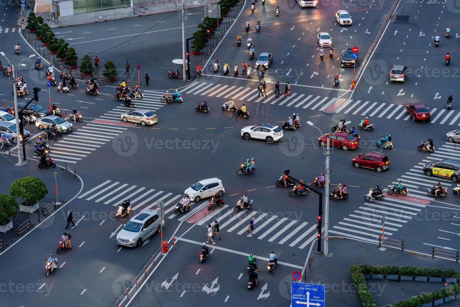 Night view of busy traffic in crowded intersection near Ben Thanh market in Ho Chi Minh city. Ben Thanh market is the symbol of Saigon, Vietnam photo