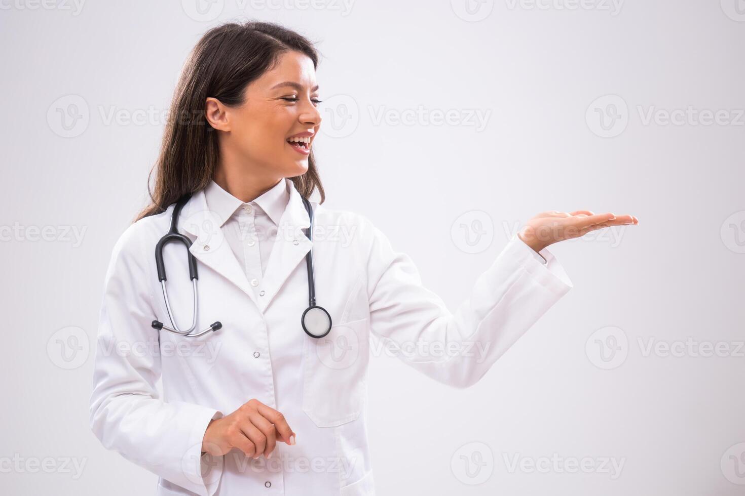 Portrait of doctor who is cheerful and holding blank space for your advert. photo