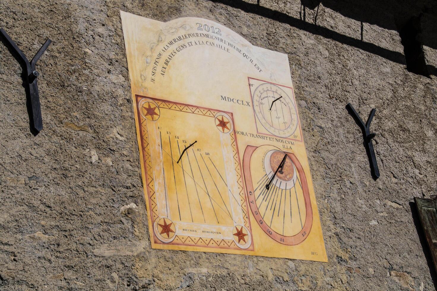 a wall with a clock on it photo
