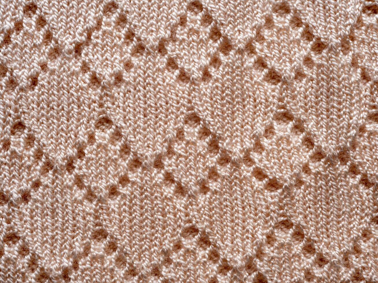 top view weave patterned surface beige knitted wool fabric closeup texture background photo