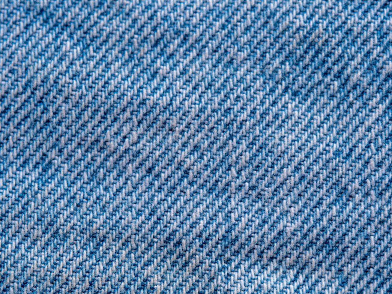 closeup texture background of light blue denim fabric photo