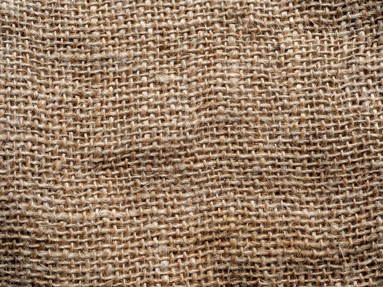 natural brown rough woven burlap fabric textured background photo