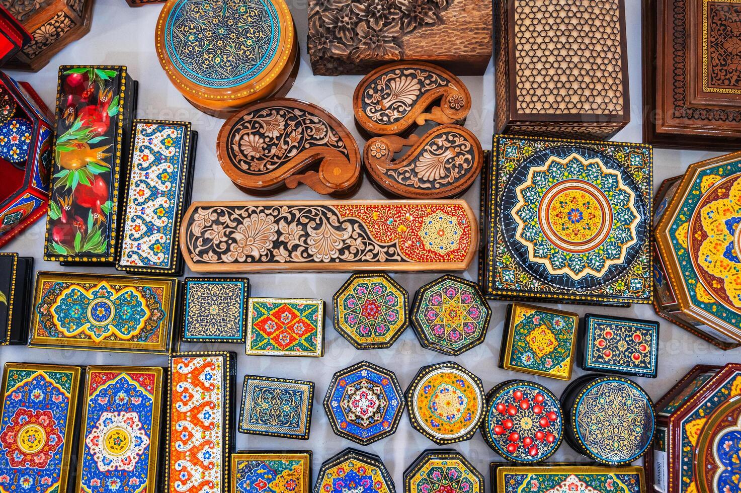asian handmade wooden carved Uzbek caskets hand-painted in a souvenir shop in Uzbekistan photo