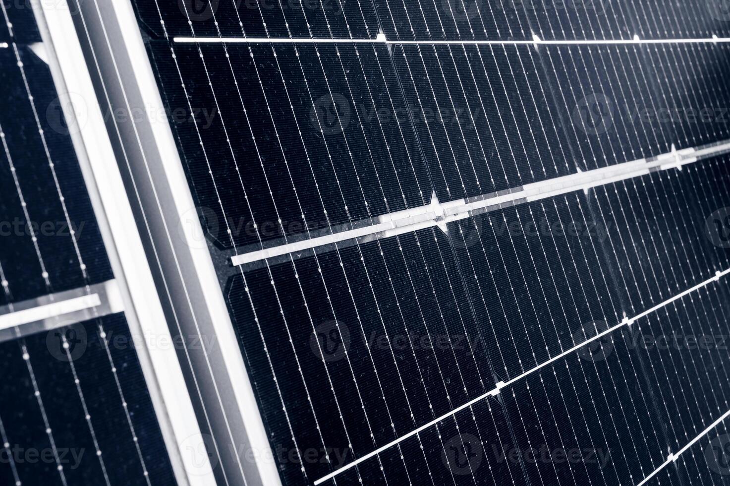 texture of cell elements of a modern black solar panel close-up. Renewable green energy photo